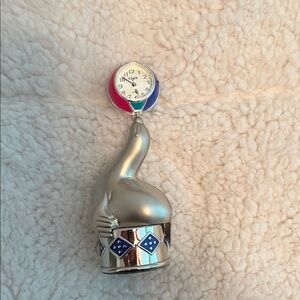 Silver Seal Clock with Blue Accents